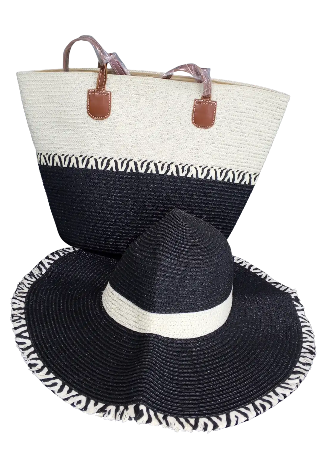 Beach bag with black and cream woven base and zebra-patterned trim.