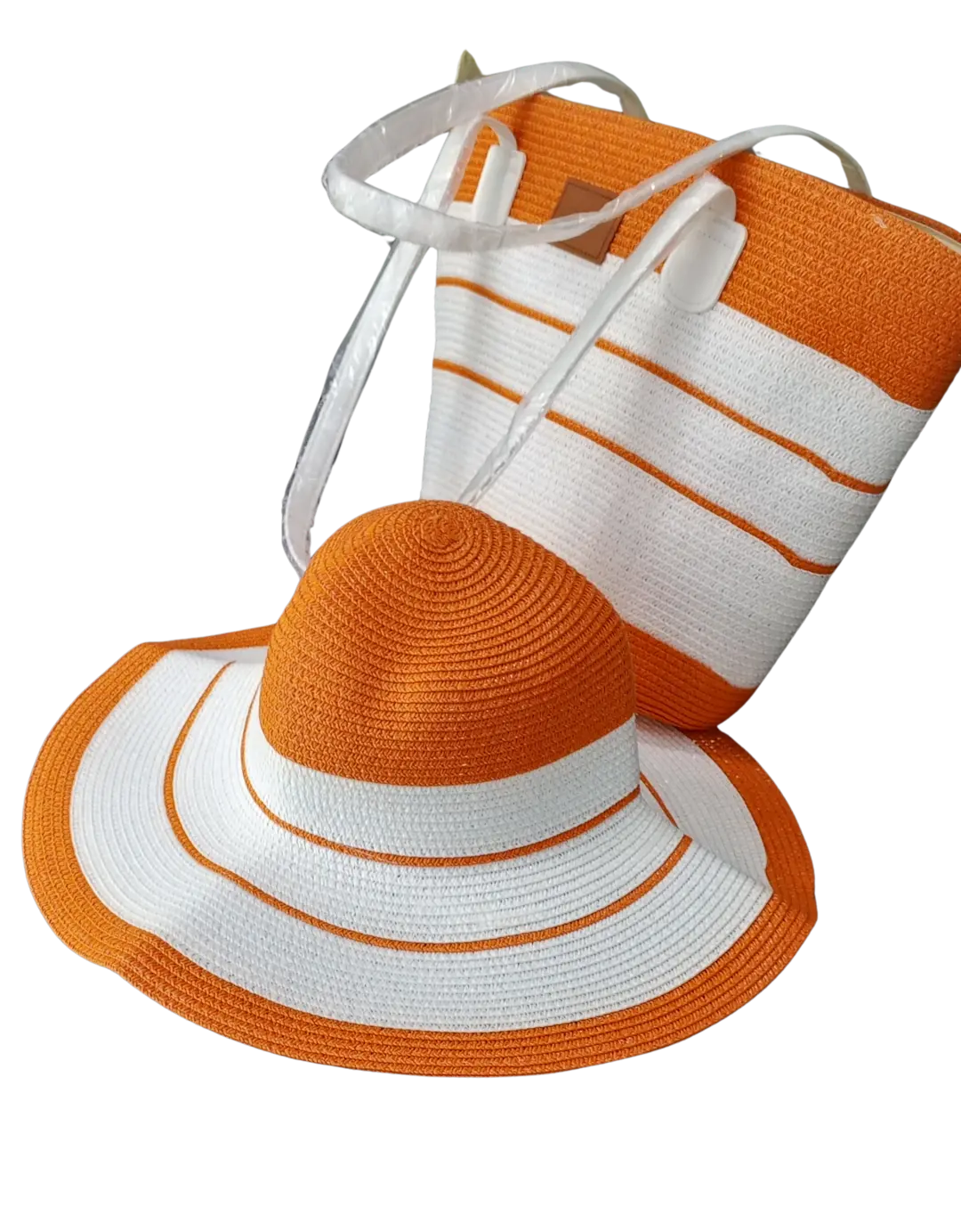 Beach bag with orange and white woven stripes and matching wide-brim hat.