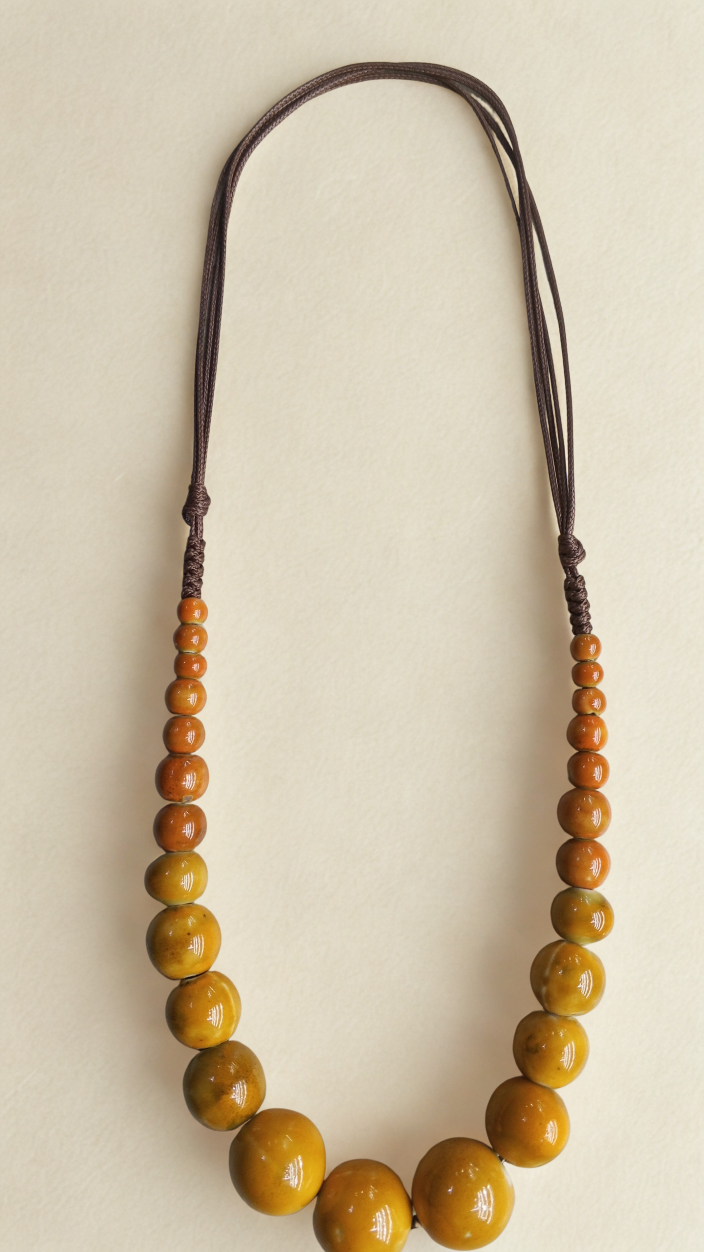 Bohemian ceramic bead necklace in earthy brown ceramic beads with handcrafted detailing.