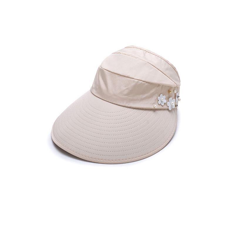 Beige sun visor hat with wide brim and pearl flower embellishments.