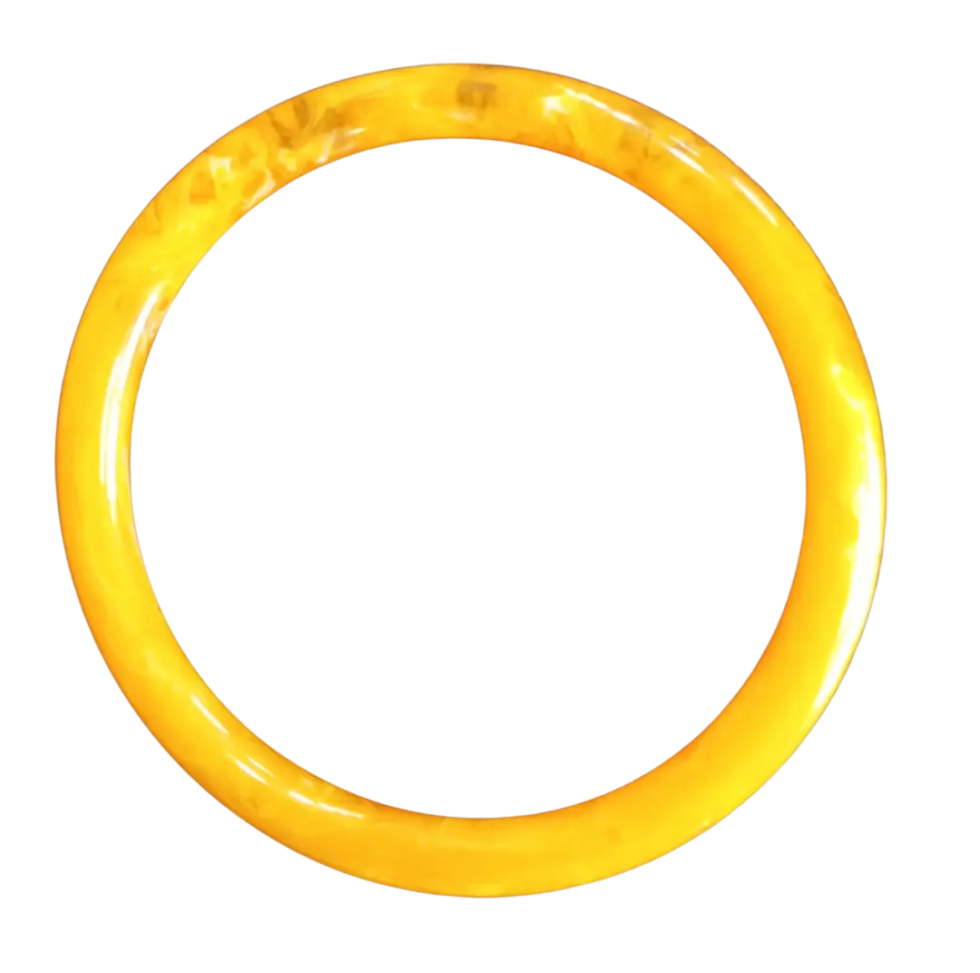 Golden yellow jade bangle with marbled texture and glossy polished surface.
