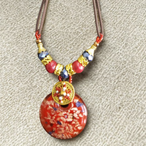 Handmade African necklace with colorful beads arranged in intricate patterns.