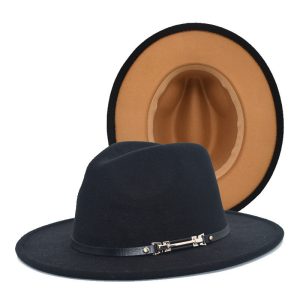Two fedora hats displayed together — a black wide‑brim fedora with leather band and buckle in the foreground, and a tan interior view of a fedora in the background.