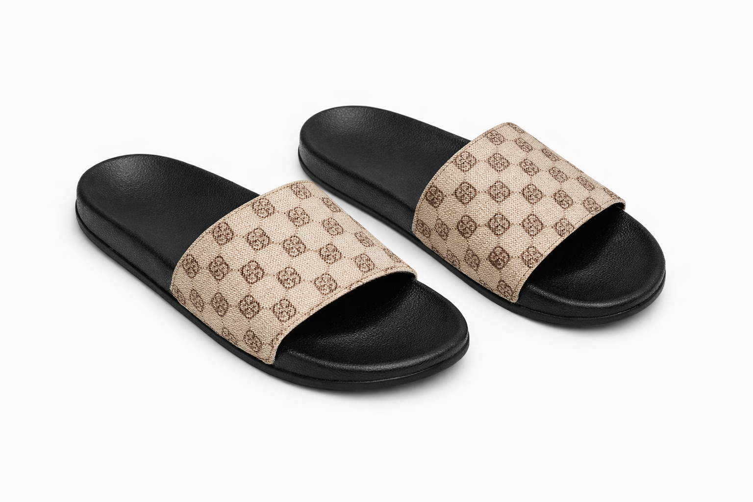 Black sole slide sandals with wide beige strap featuring repeating brown geometric logo pattern.