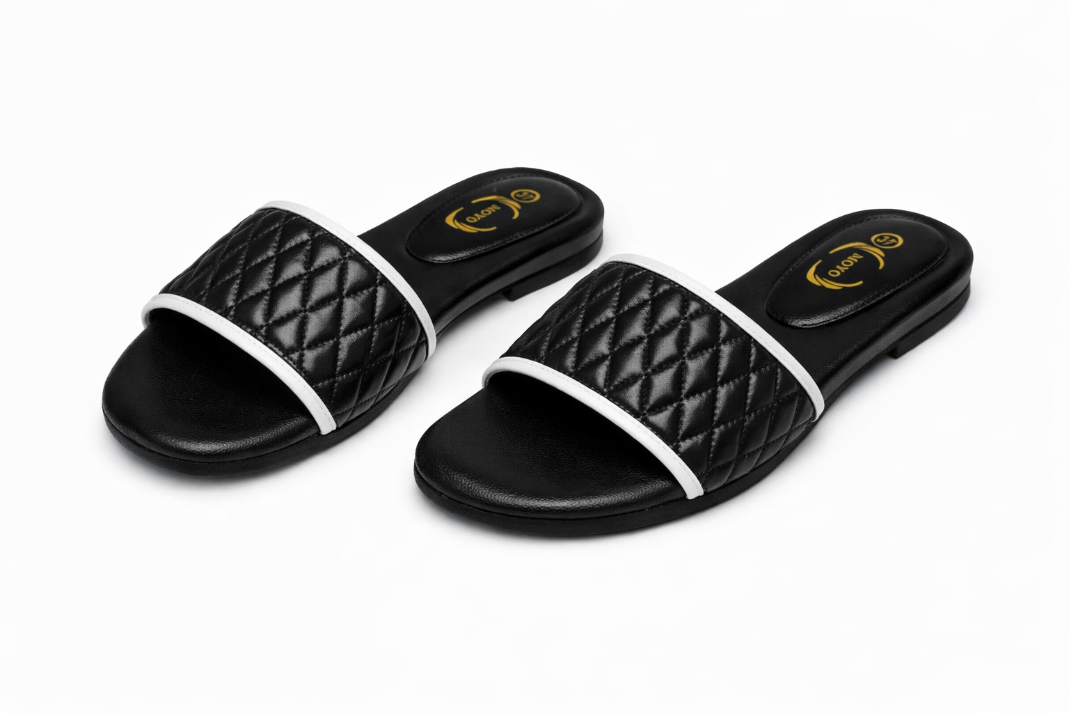 Black quilted women’s slide sandals with diamond‑pattern straps, white trim, modern casual footwear in Nairobi Kenya.