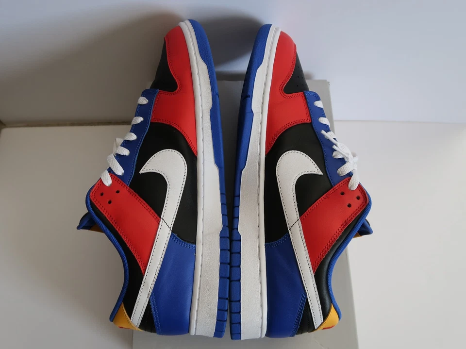 Nike Dunk Low Tennessee State University Sneakers with 1912 Heel Embroidery Nairobi Kenya Nike Dunk Low Tennessee State University sneakers with red, blue, black, and white panels, white swoosh, white laces, and white midsole Nairobi Kenya.