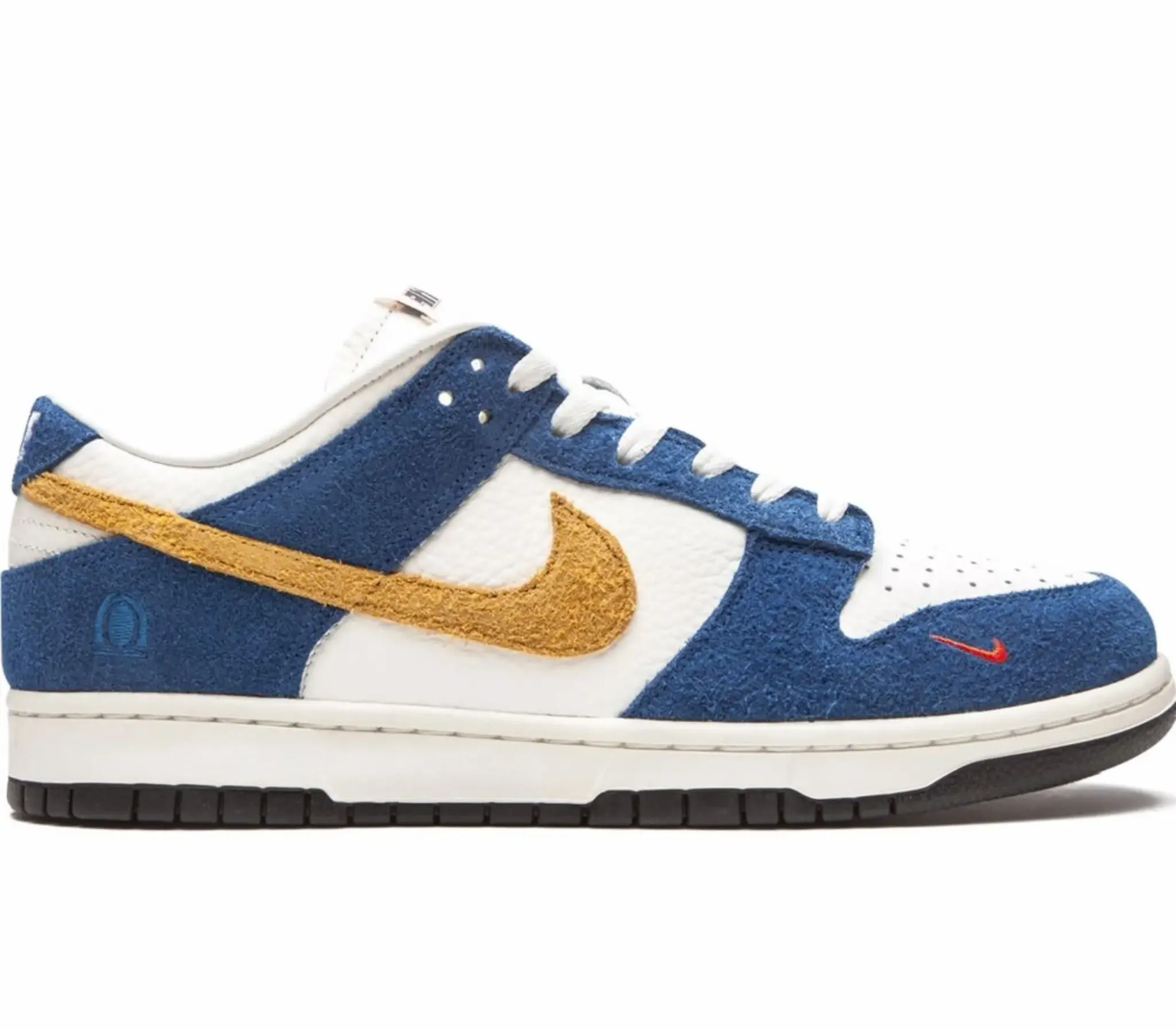 Nike x Kasina Dunk Low ’80s Bus sneaker with blue suede overlays, white leather panels, textured yellow swoosh, and mini orange swoosh near toe Nairobi Kenya.