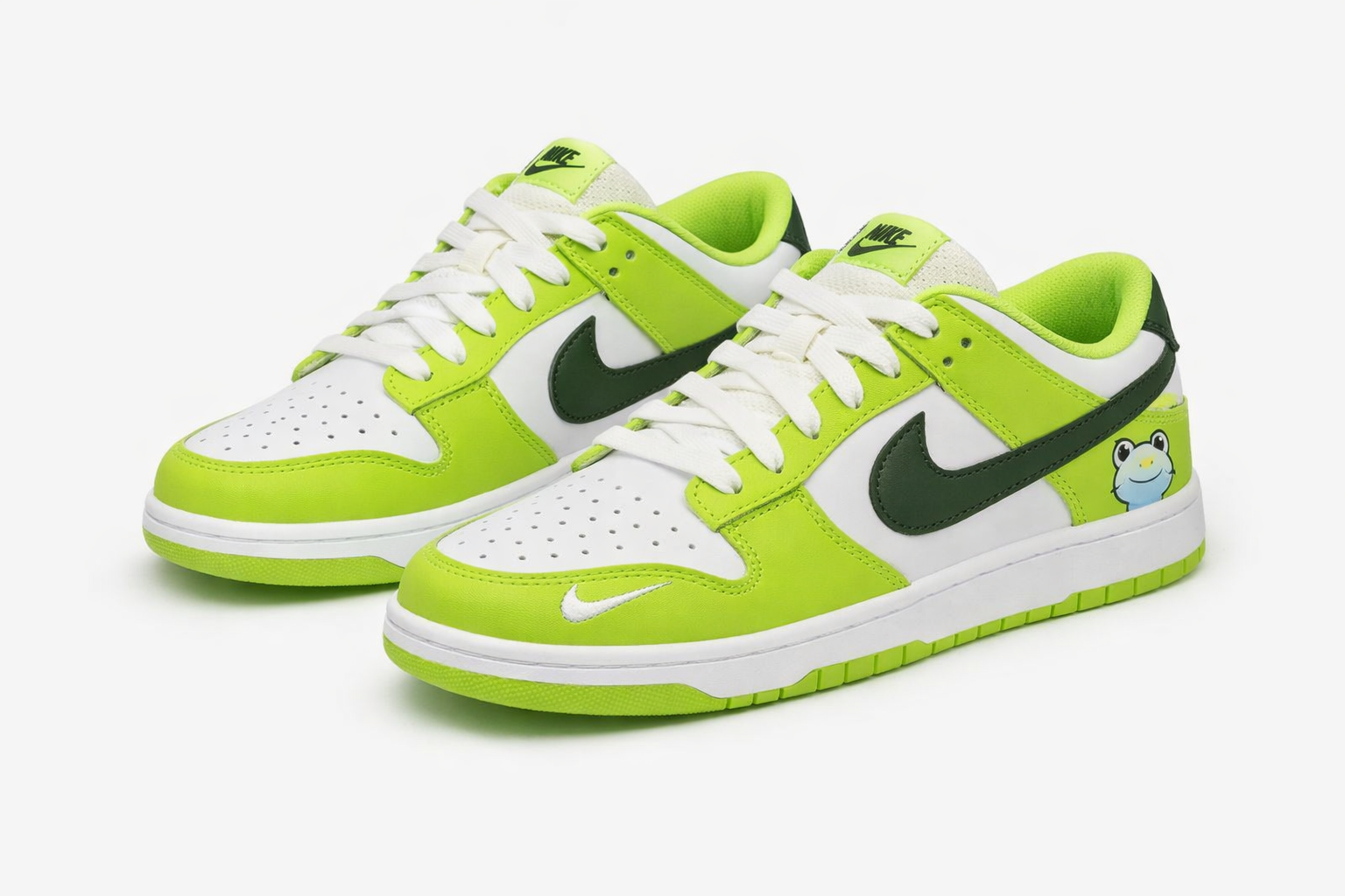 SB Dunk Low sneakers white with lime green overlays, dark green swoosh, frog graphic on heel, skateboarding shoes in Nairobi Kenya.