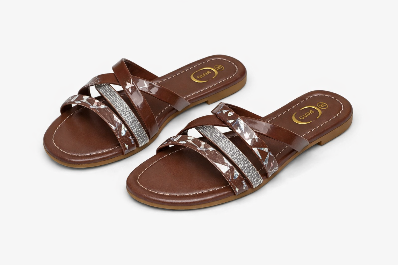 Brown glossy women’s crisscross strap sandals with glitter detailing and reflective patterns, summer footwear Nairobi Kenya.